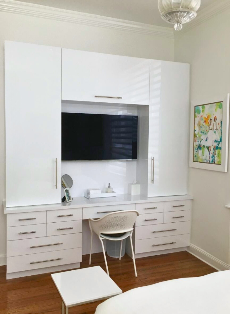 custom bedroom vanity with cabinets, drawers and tv hang