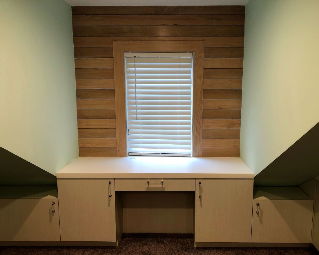 desk built into unused space in attic transformation