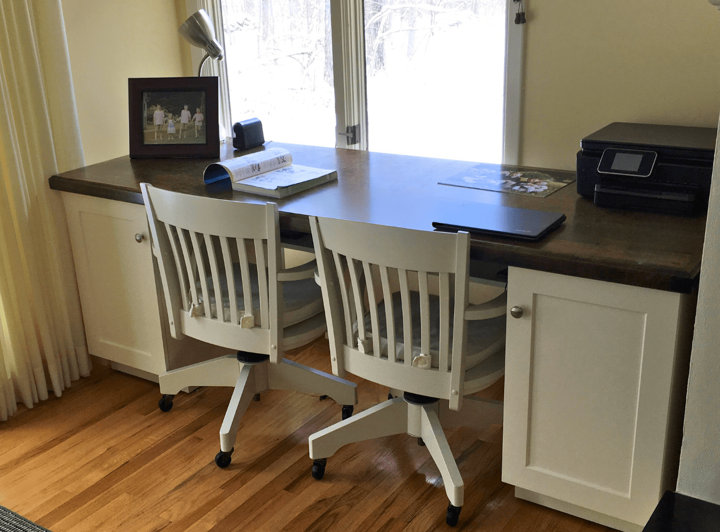 unused space transformed into a large built-in desk feature