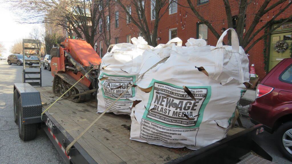 A trailer with a lot of bags on it that say new age