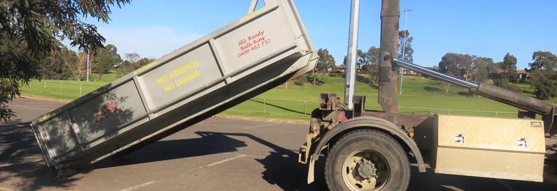 Dump Truck Unloading Waste Container