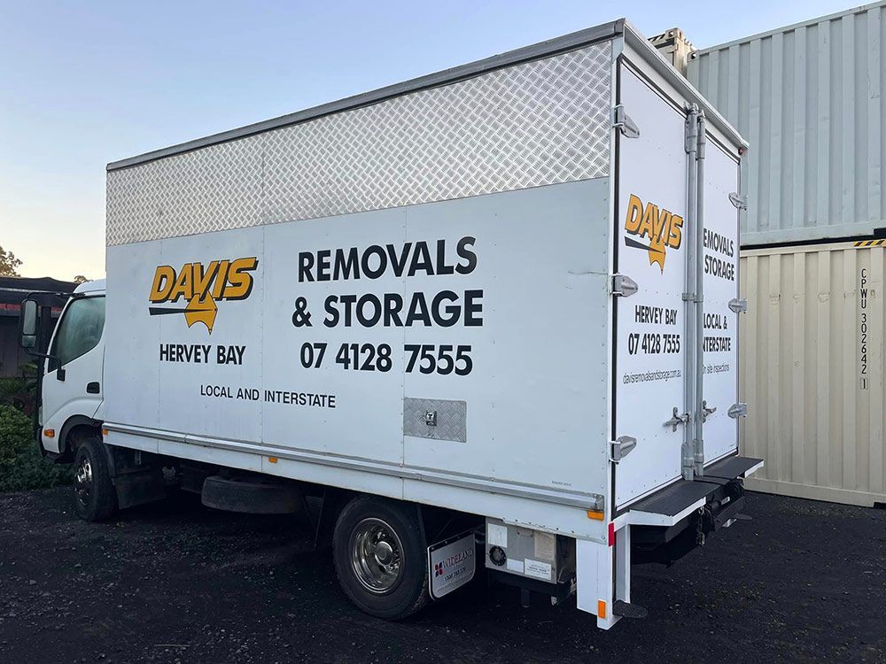 A White Davis Removals and Storage Truck is Parked in a Parking Lot — Davis Removals & Storage in Gold Coast, QLD
