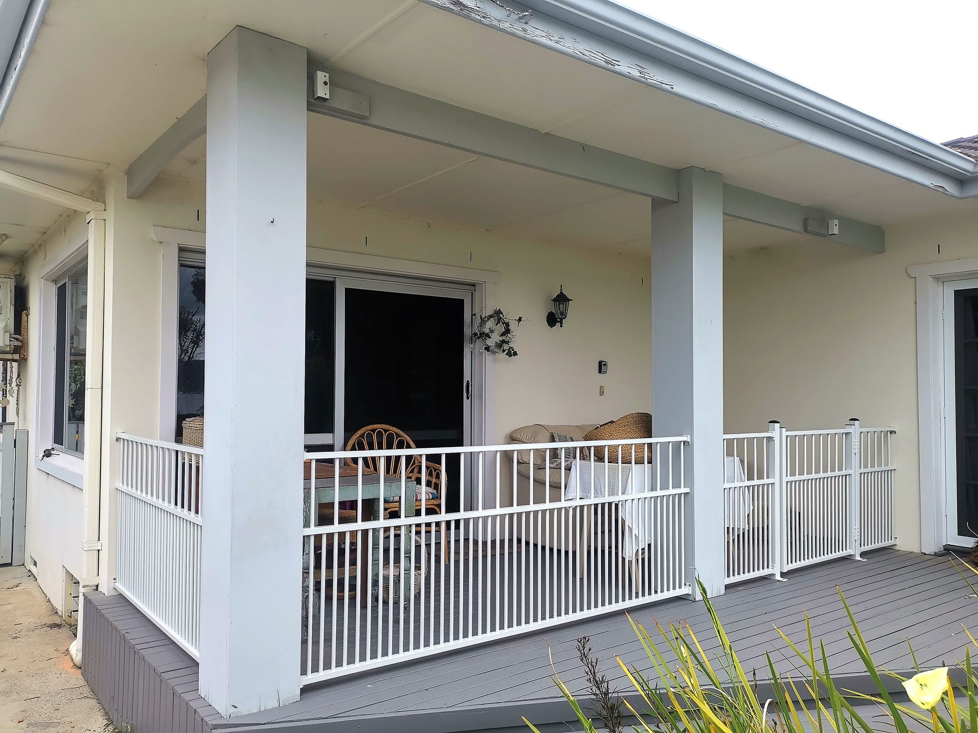 A Wooden Fence is Sitting Next to a Brick Wall— WeFence in Lisarow, NSW