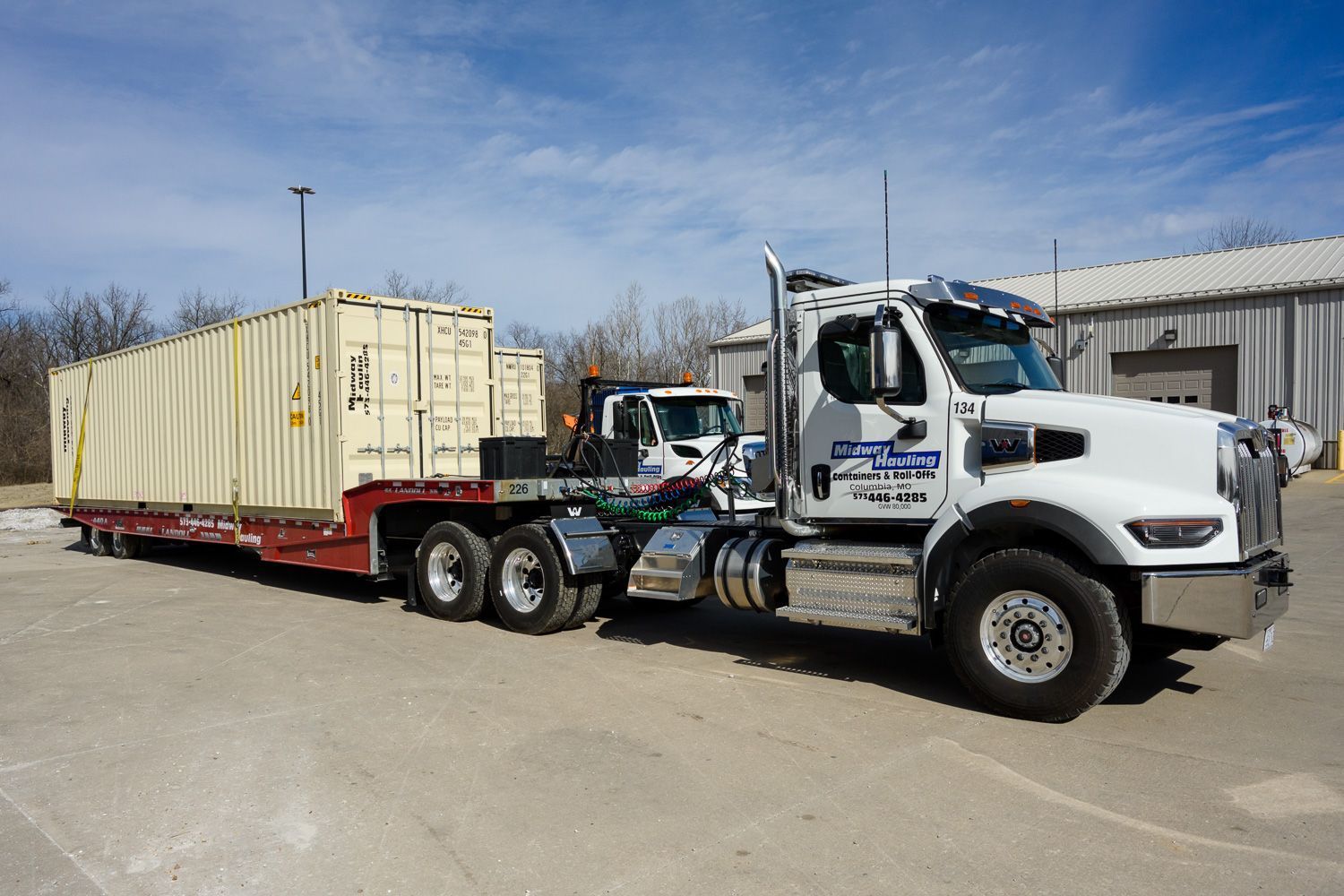 A truck with a trailer — Columbia, MO — Midway Hauling Containers & Roll-Offs