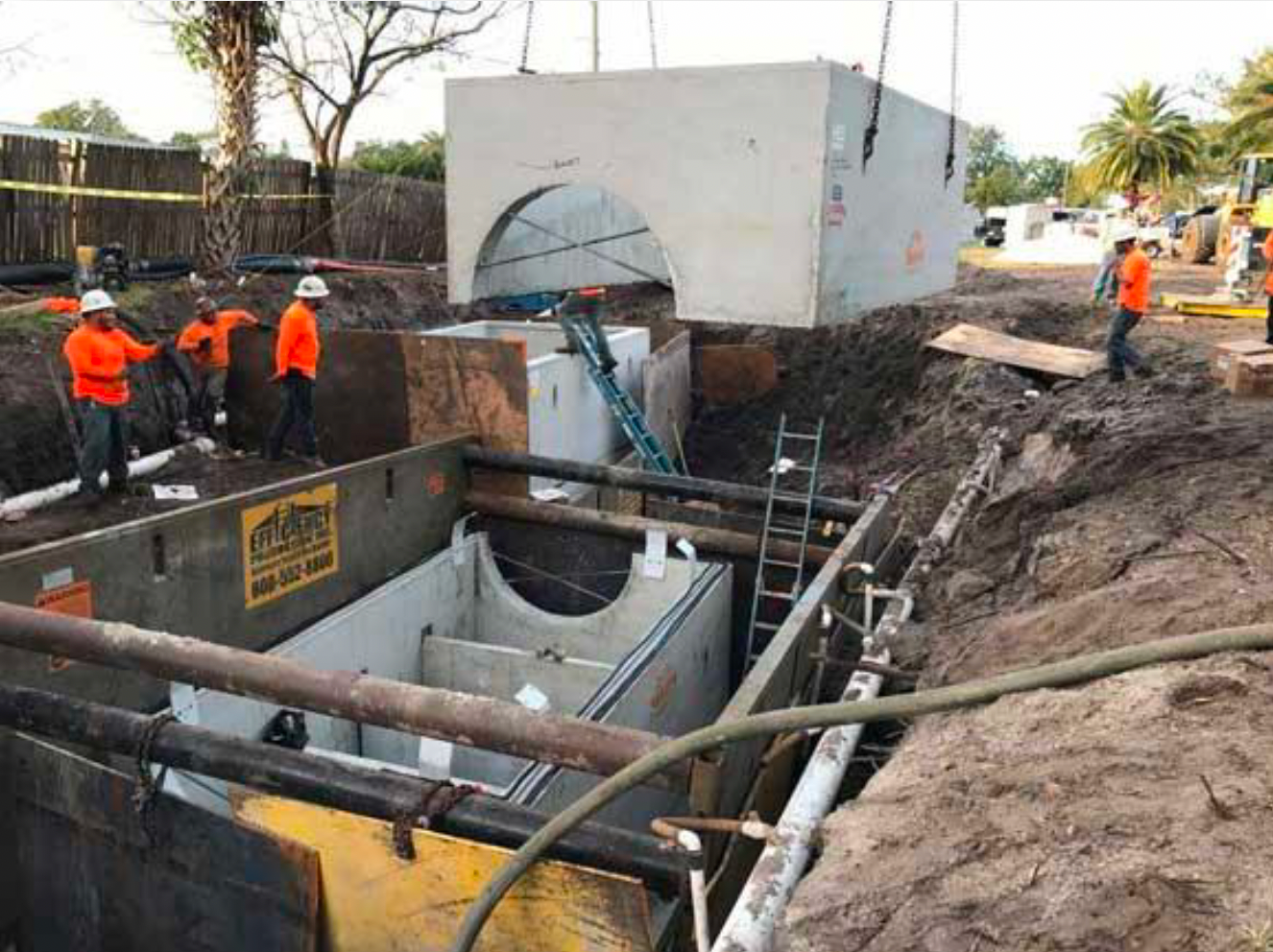 A group of construction workers are working on a tunnel.