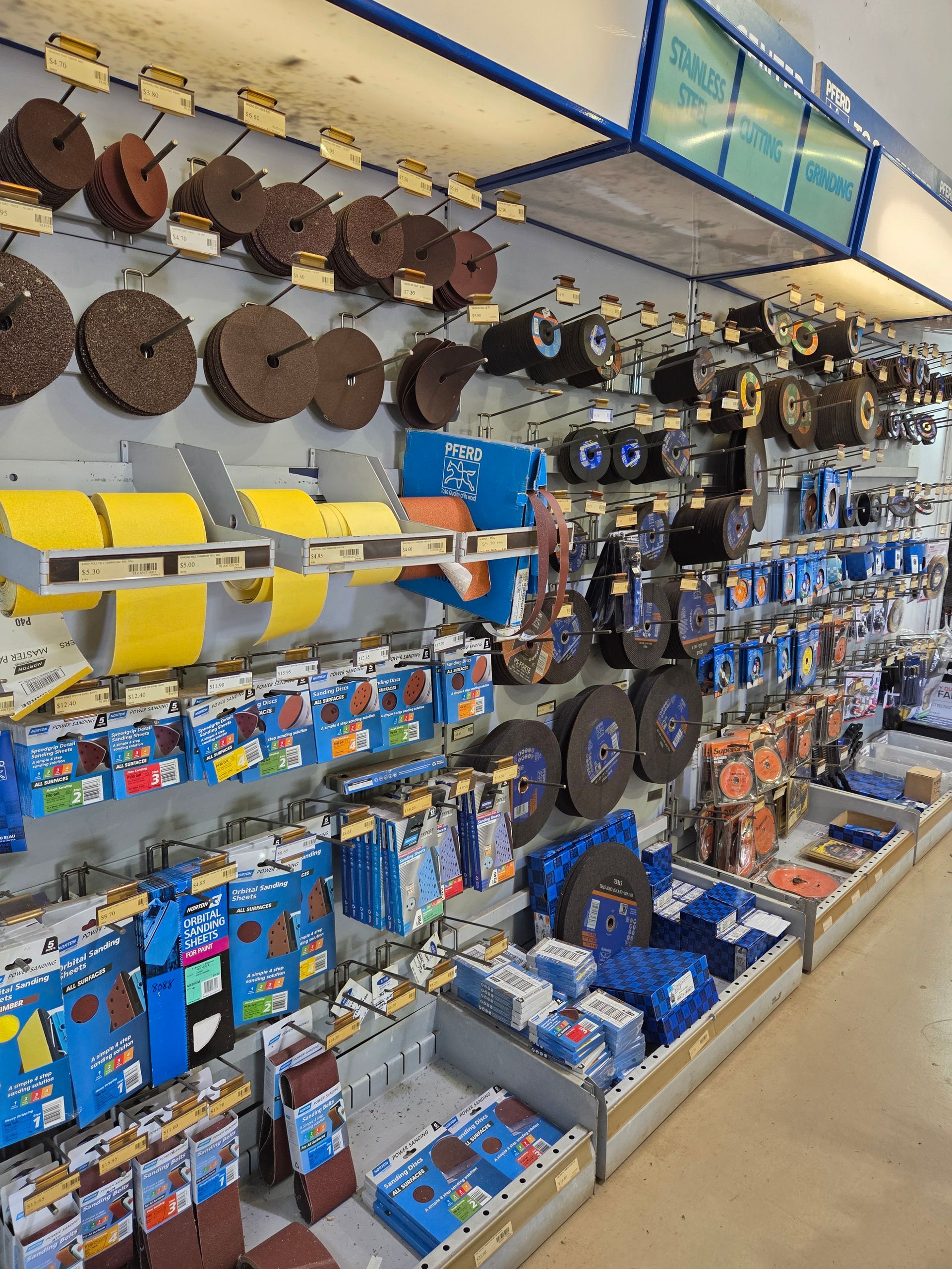 A Store Display Wall Filled With Various Abrasive Grinding and Sanding Discs — Humpty Doo Hardware in Humpty Doo, NT
