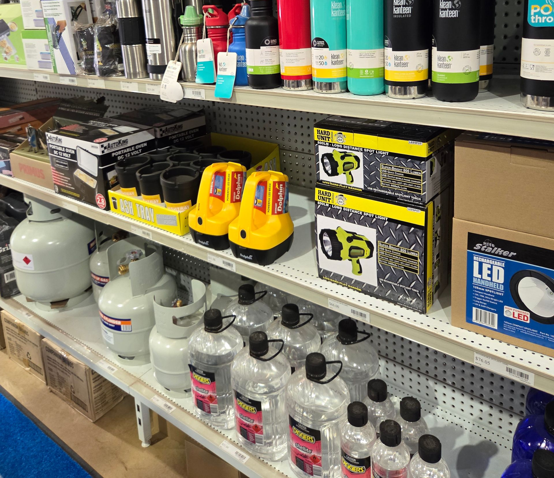 Shelves in a Store Stocking Insulated Water Bottles, Yellow Spotlights — Humpty Doo Hardware in Humpty Doo, NT