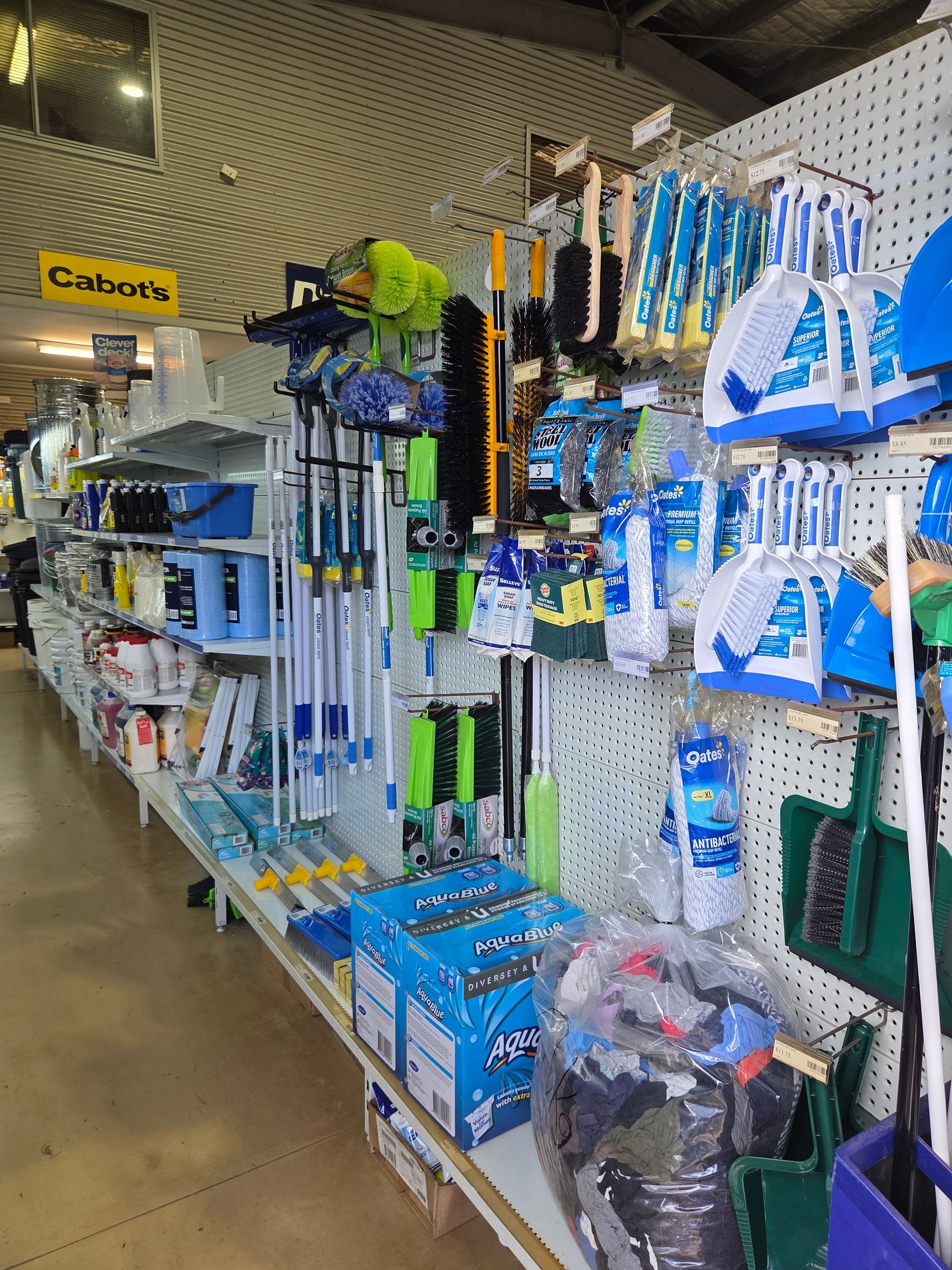 A Retail Store Aisle Filled With Cleaning Supplies — Humpty Doo Hardware in Humpty Doo, NT