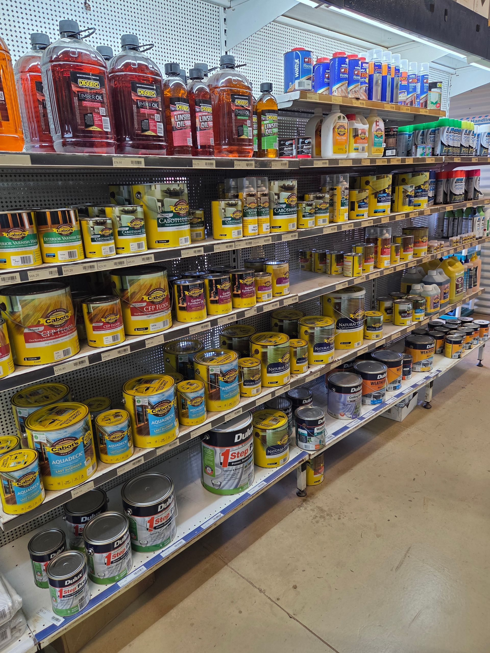 A Retail Shelf Stocked With Various Bottles and Cans of Automotive Products — Humpty Doo Hardware in Humpty Doo, NT