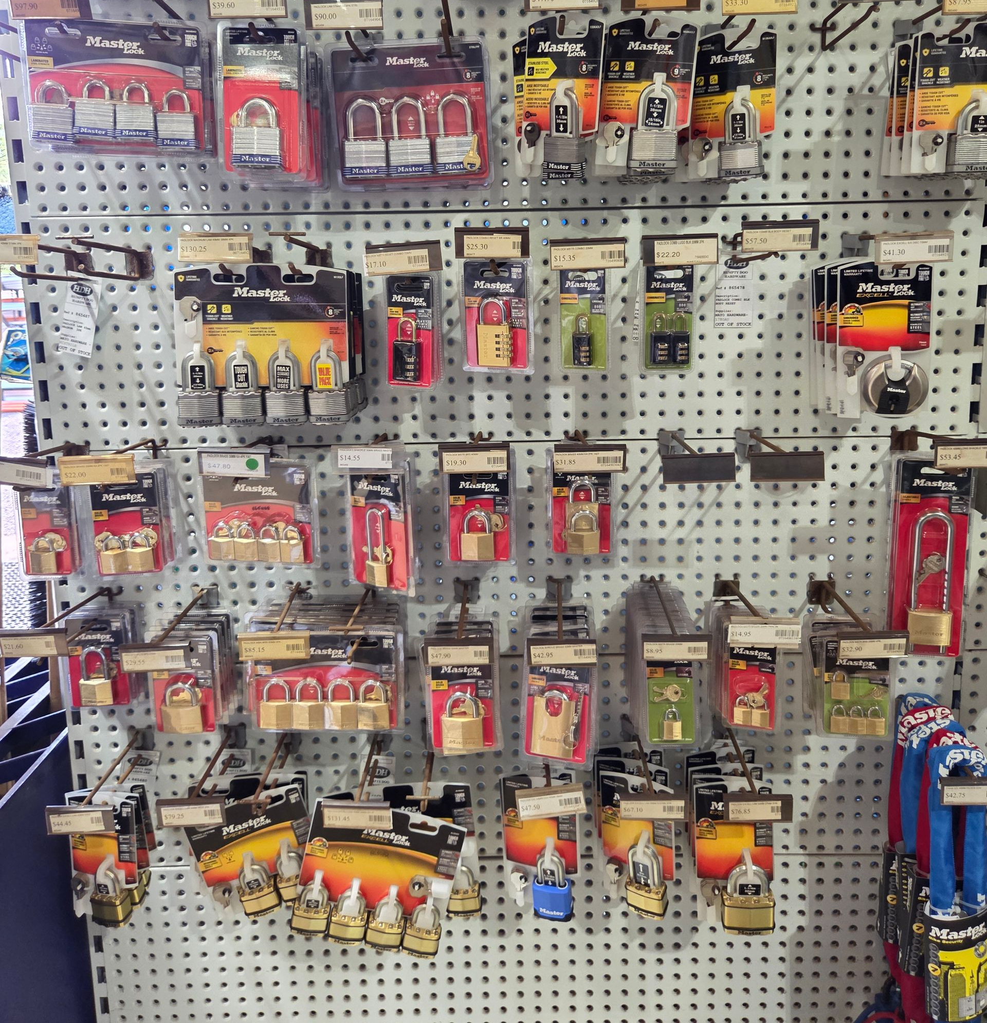 A Retail Store Shelf Displaying Various Packaged Master Lock Padlocks — Humpty Doo Hardware in Humpty Doo, NT