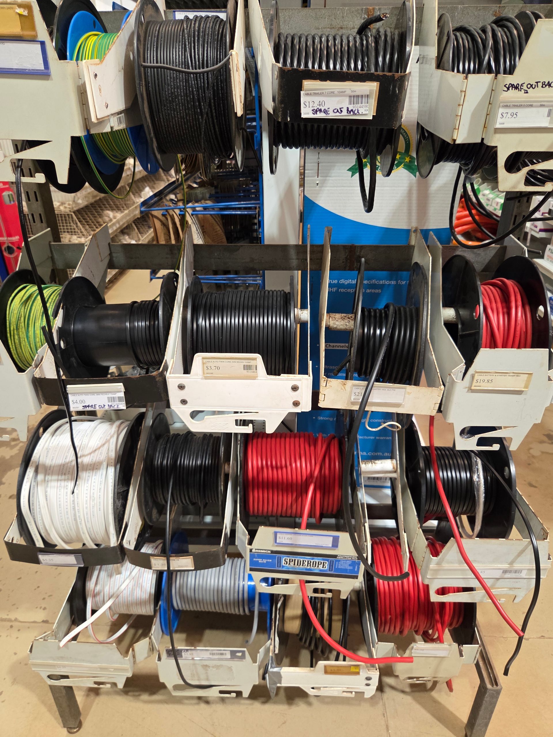 A Store Display Shelf Stocked With Multiple Spools of Electrical Wiring — Humpty Doo Hardware in Humpty Doo, NT