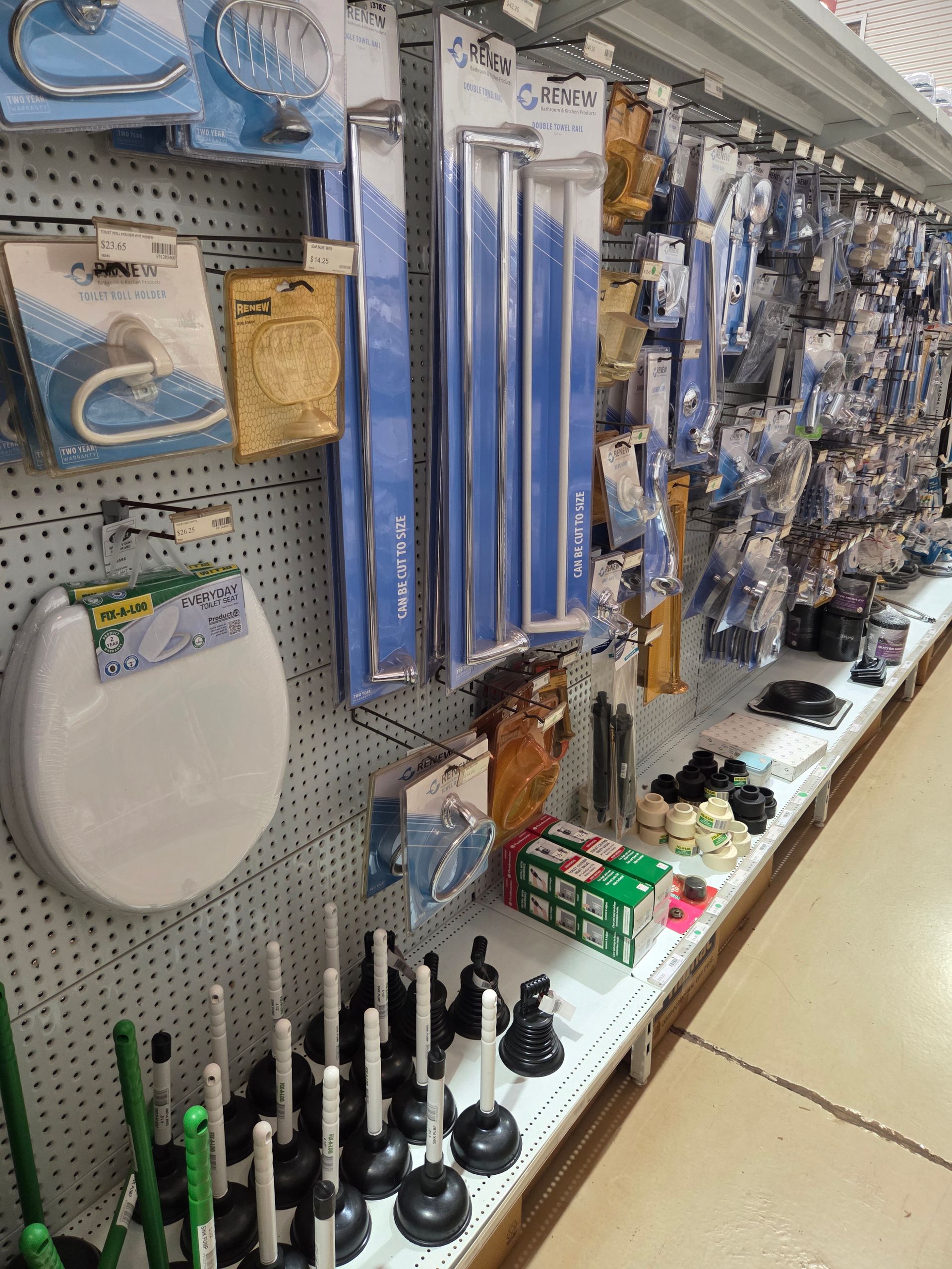 A Hardware Store Aisle Features Rows of Plungers — Humpty Doo Hardware in Humpty Doo, NT