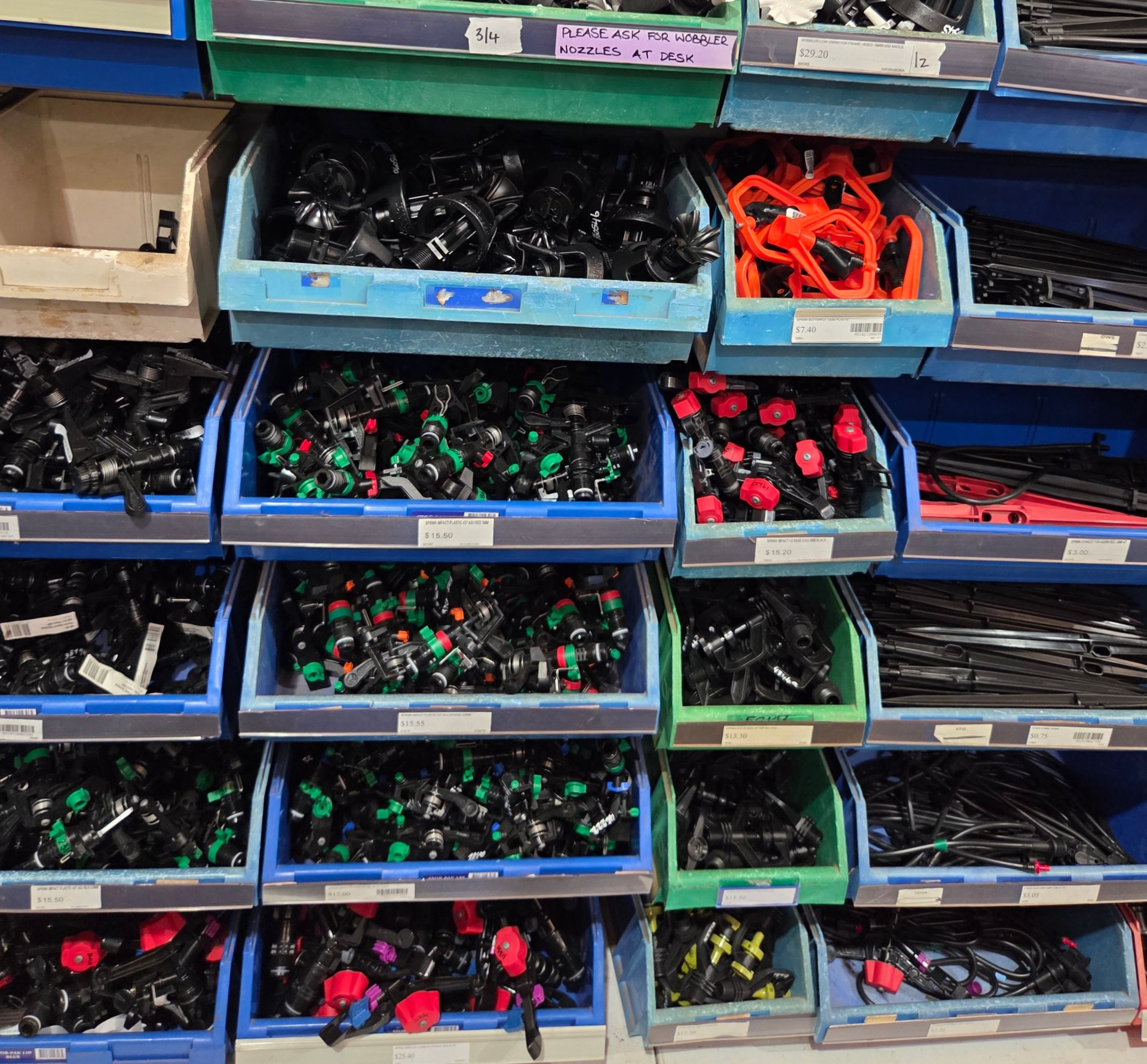 Shelves of plastic bins filled with assorted colourful connectors and hardware parts — Humpty Doo Hardware in Humpty Doo, NT