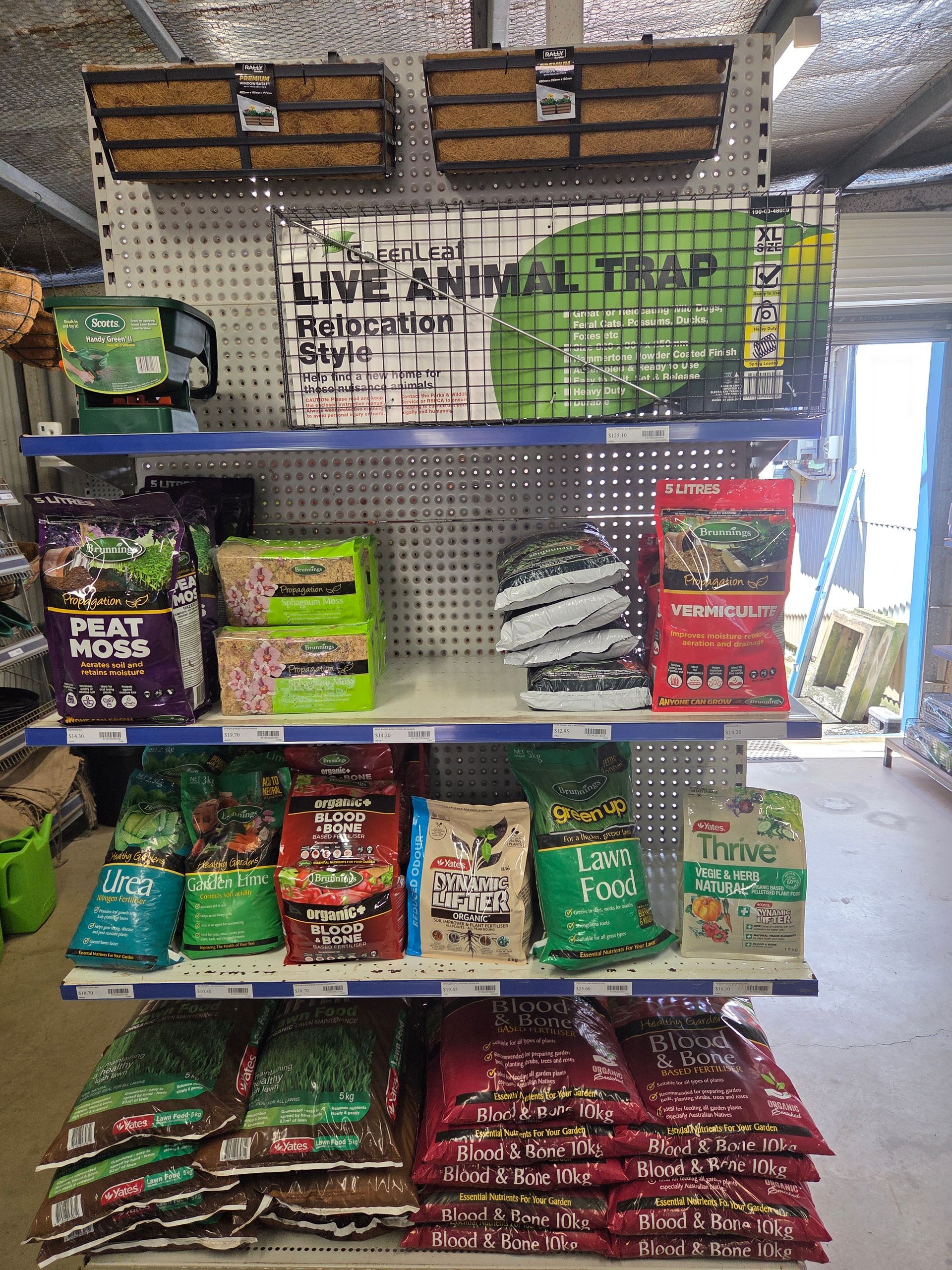 A Retail Display Shelf Stocked With Gardening Supplies — Humpty Doo Hardware in Humpty Doo, NT