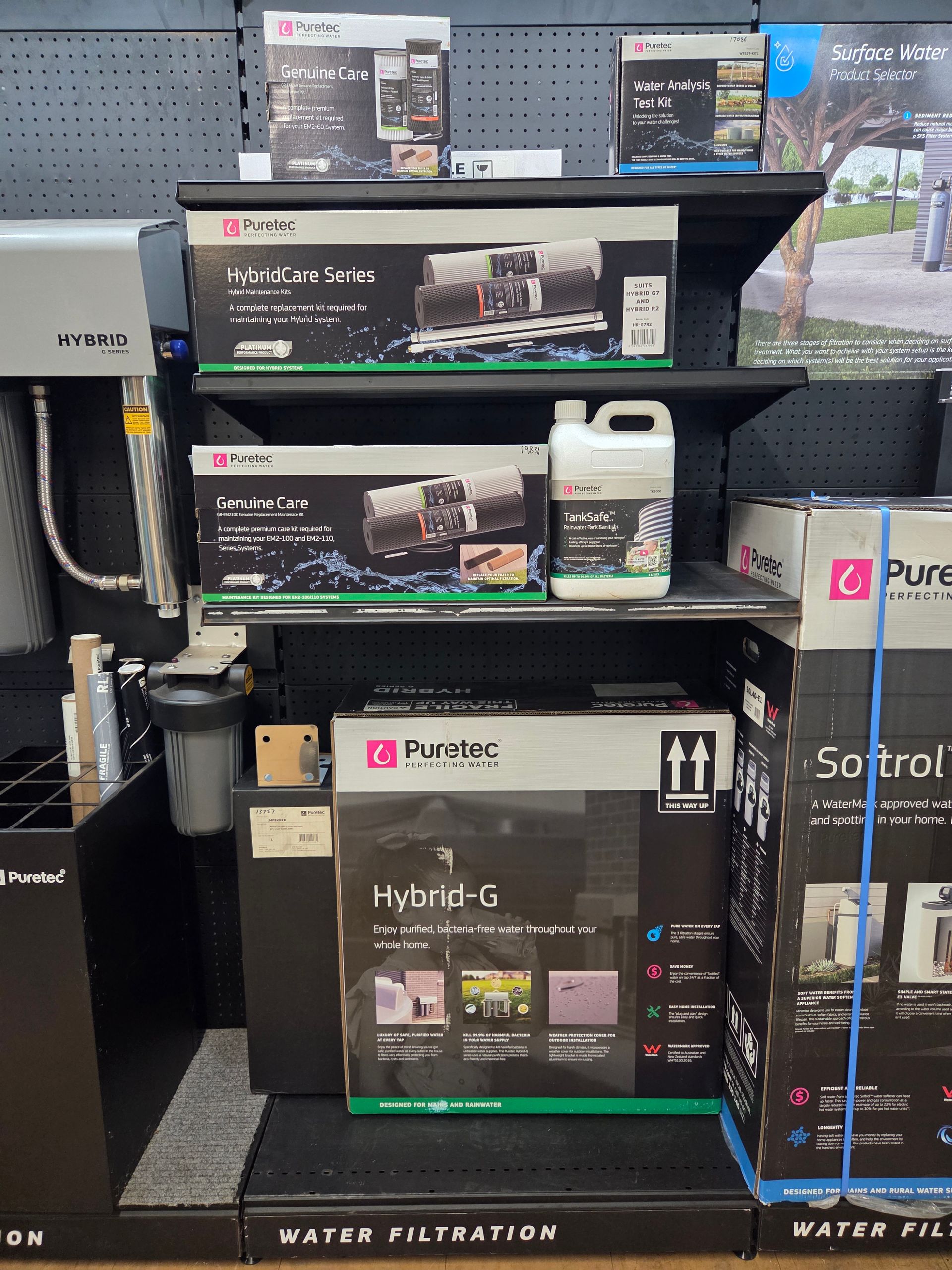 Stacked aquarium and water filtration product boxes on store shelves. — Humpty Doo Hardware in Humpty Doo, NT