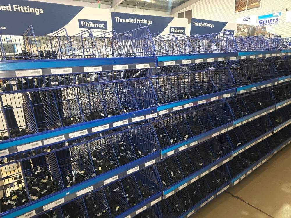 A Hardware Store Aisle Features Multiple Rows of Blue Wire Bins — Humpty Doo Hardware in Humpty Doo, NT