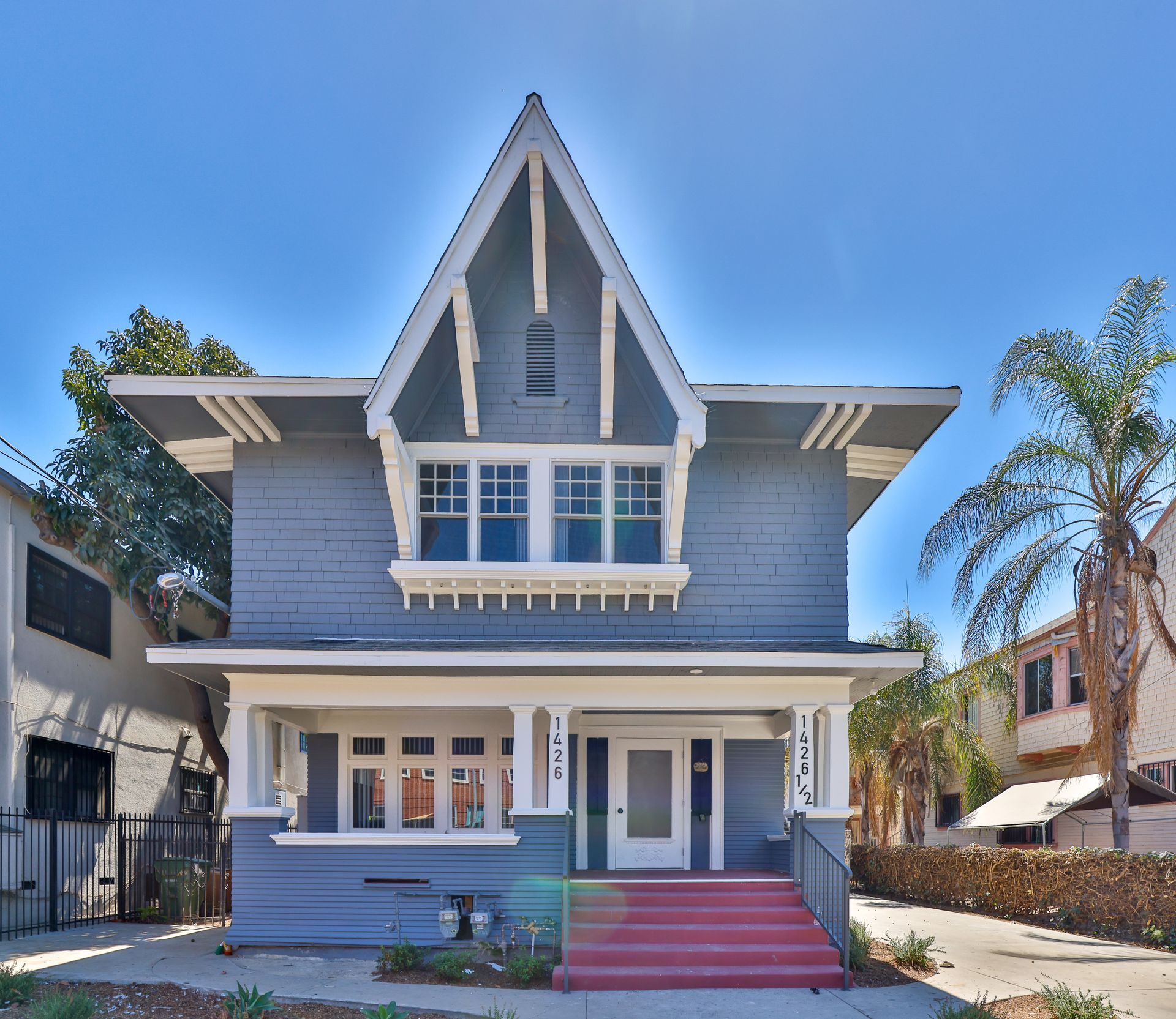 This image shows a gray , white theme house