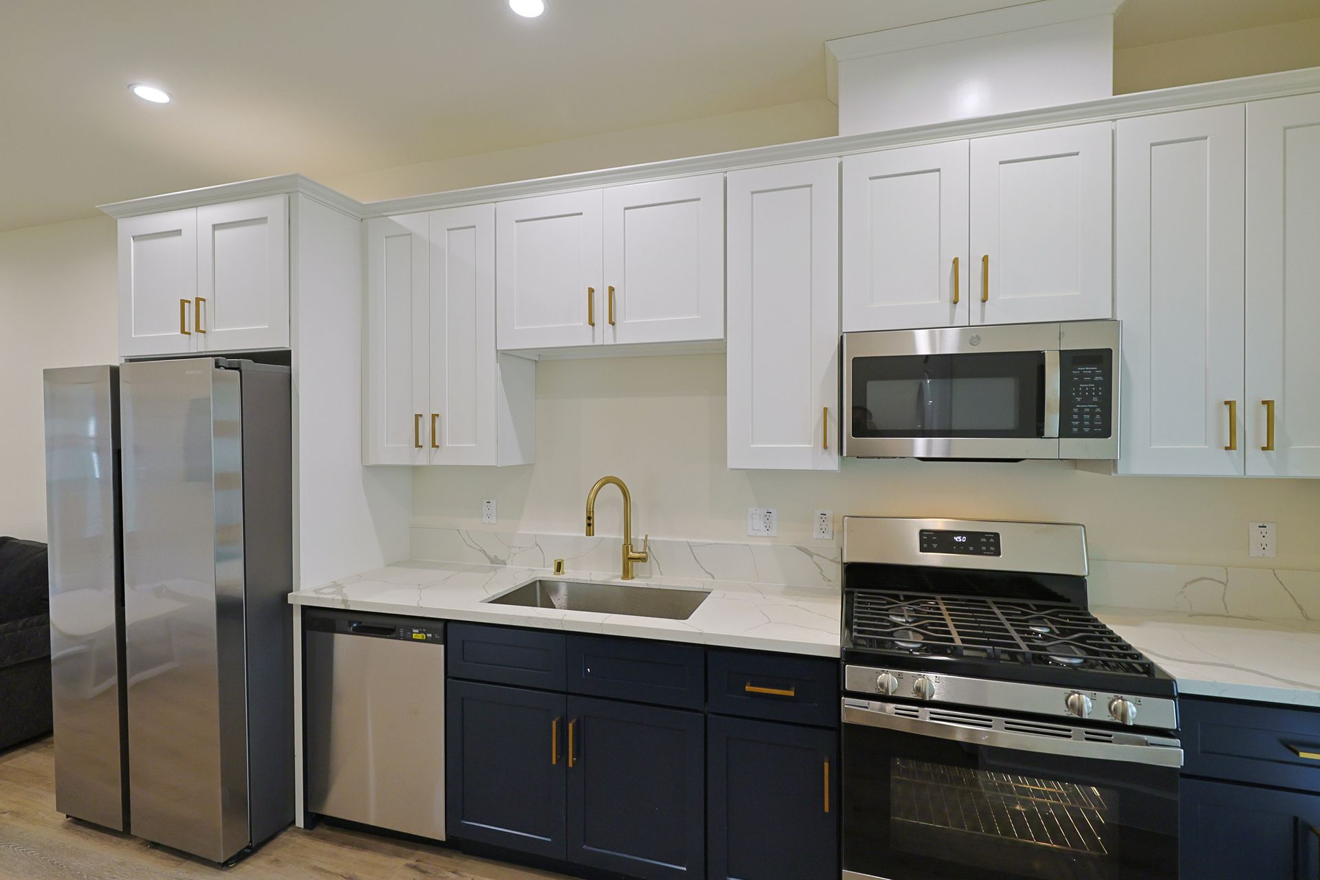 this image shows a small kitchen with white and black background.