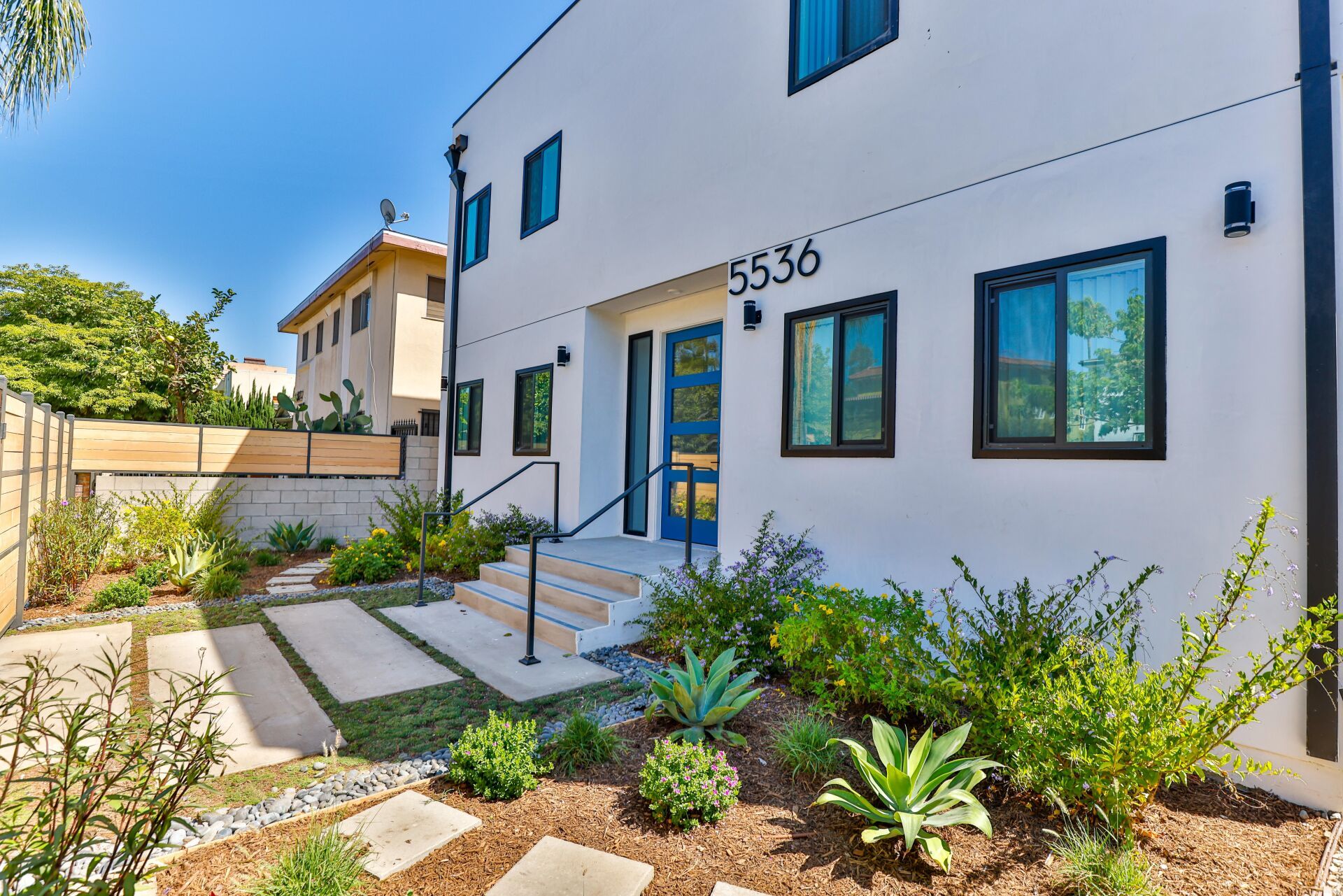 this image shows a luxury building with white  and blue background