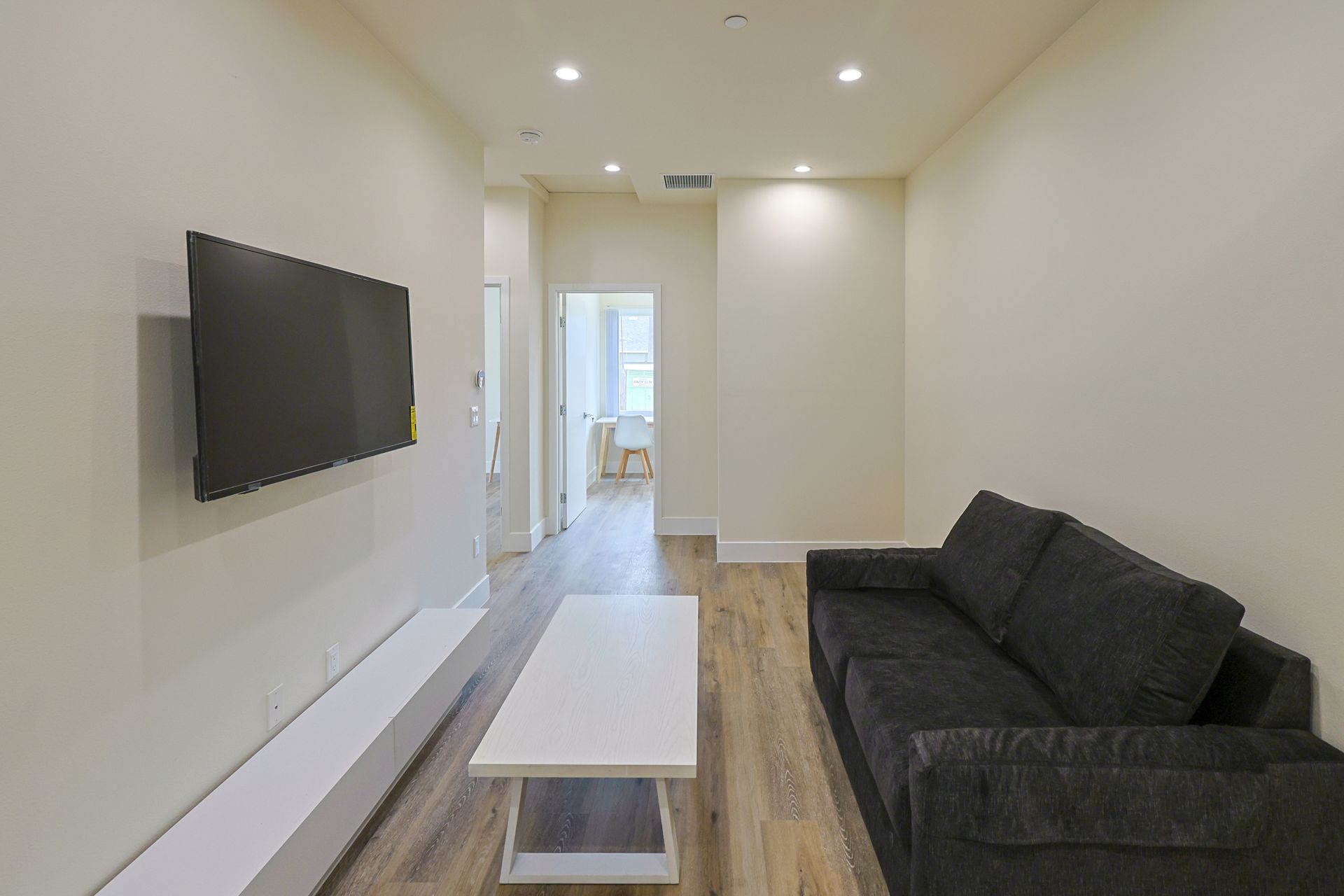 this image shows a T.V lounge in the house with white and black background