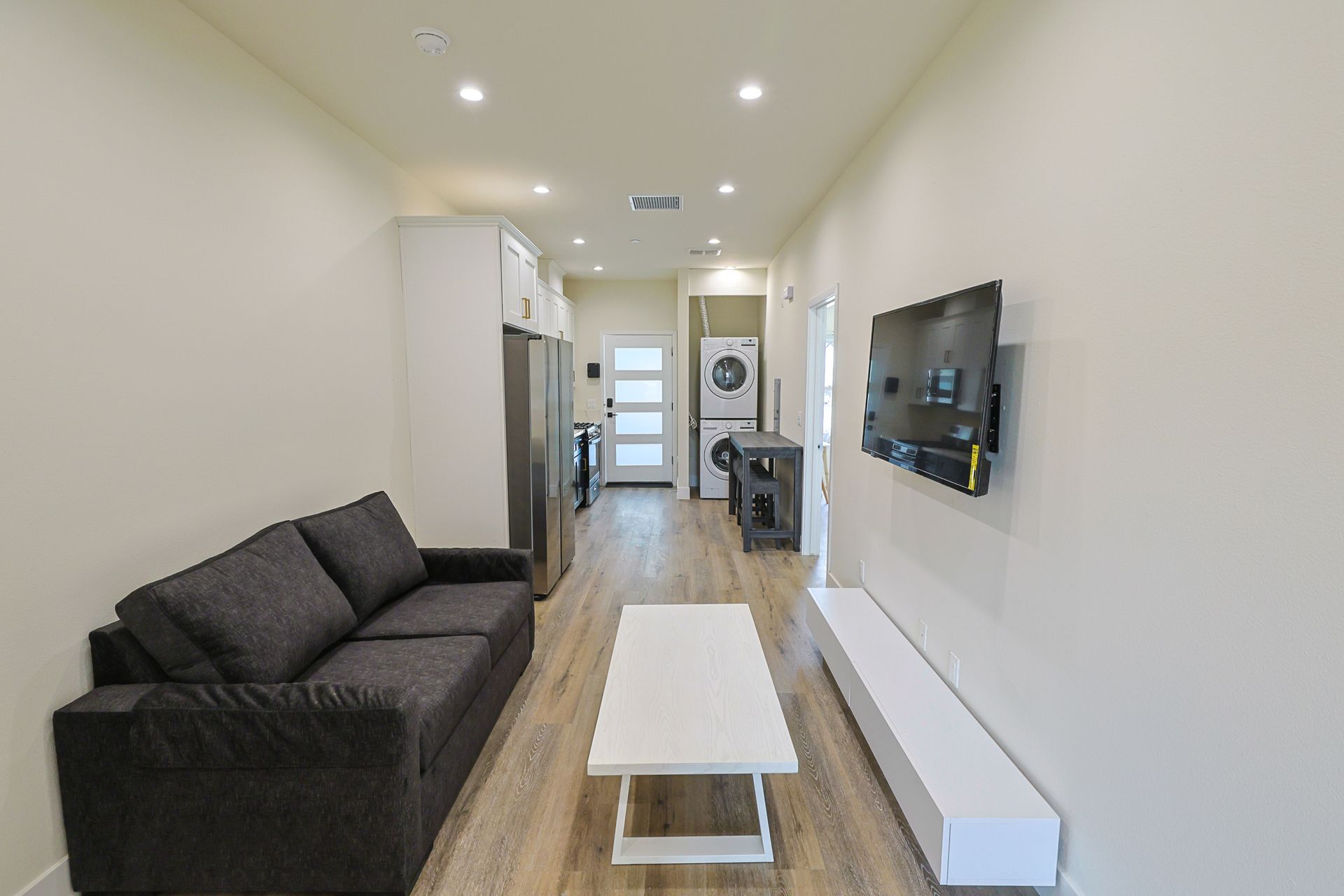this image shows a living room with a sofa and other useful accessories