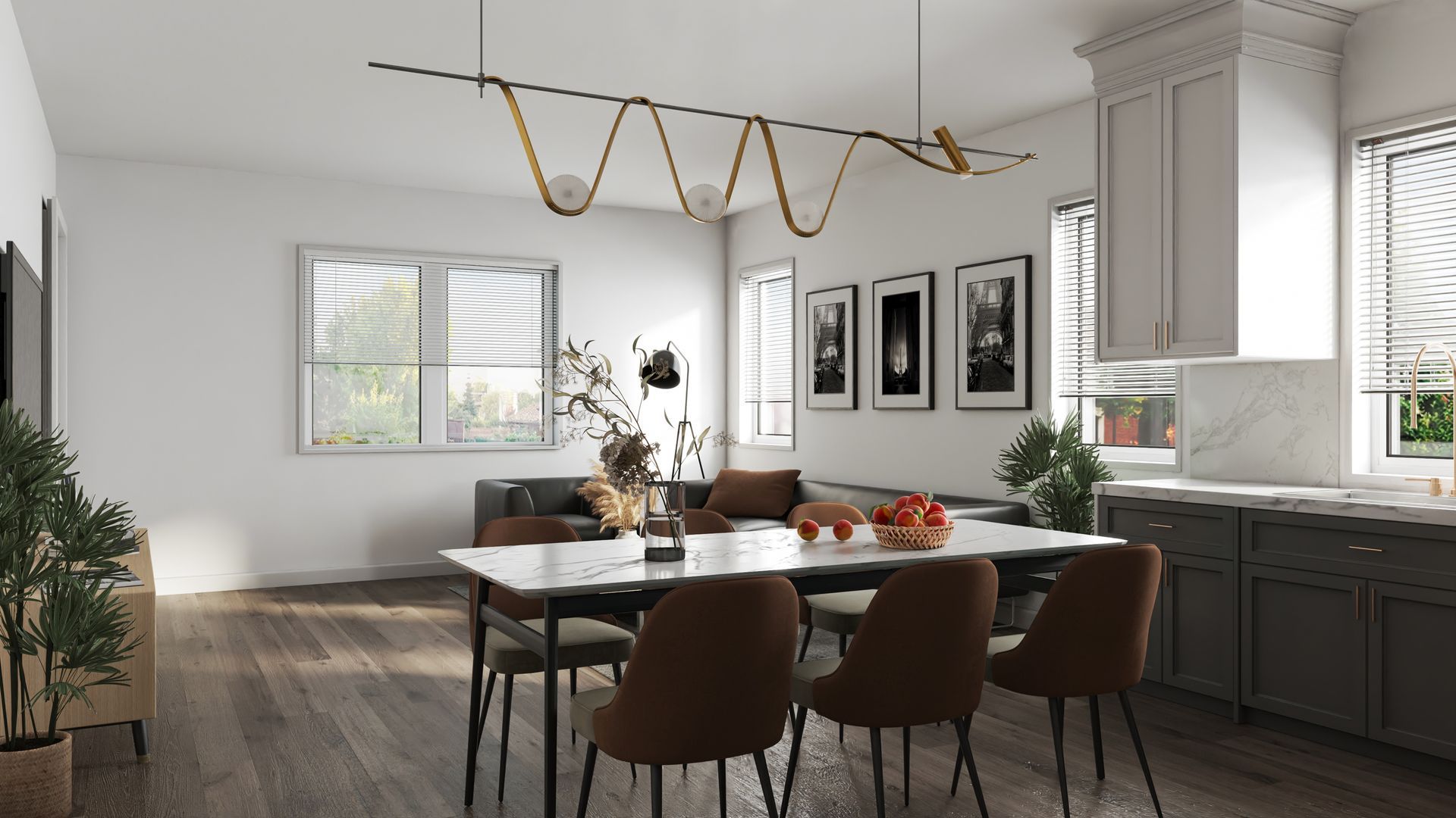 This image showing a luxurious kitchen with dinning table and lots of space in it.