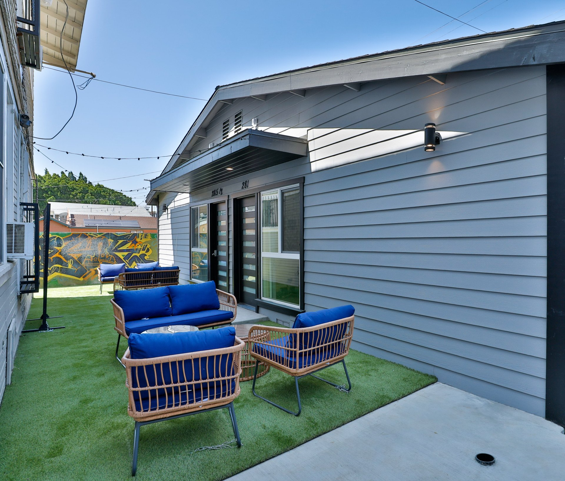 This image shows blue color chairs in the garden