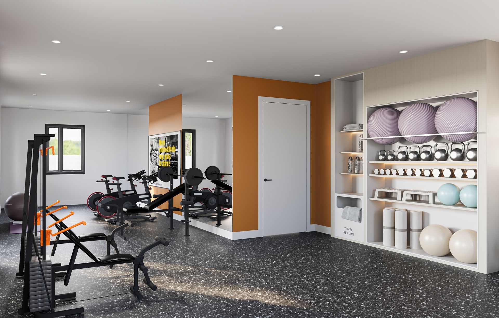 A modern gym with black speckled floors, exercise equipment, a white door, and shelves stocked with balls and weights.