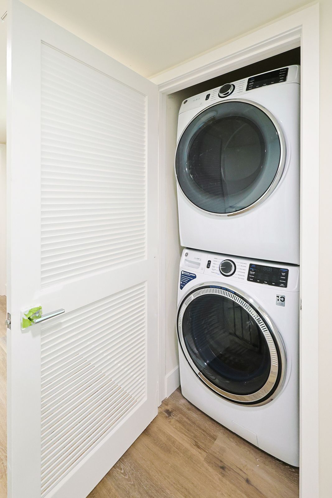 This image shows the washing and dryer machine and white door