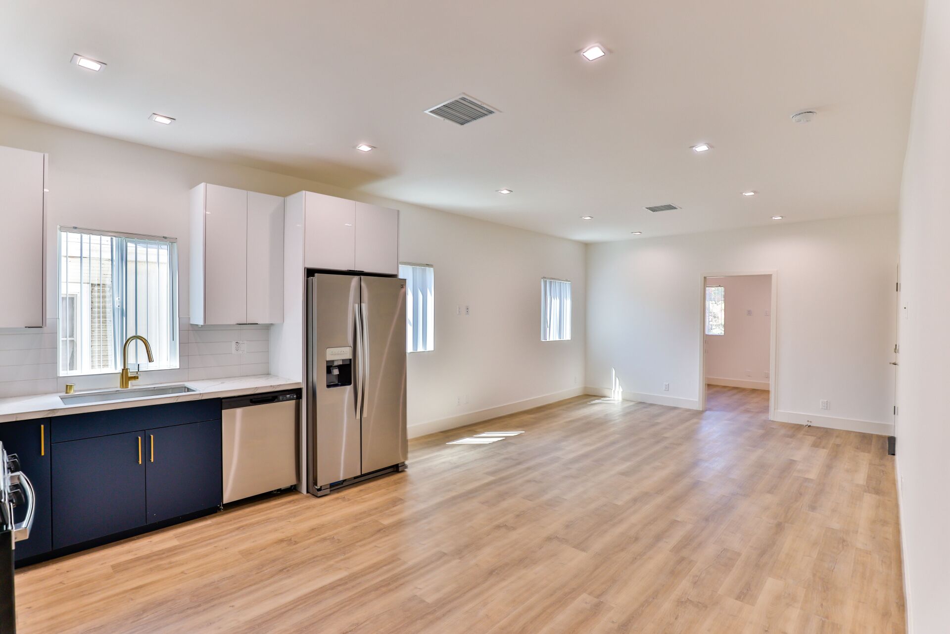 this image shows a kitchen with white and brown background.