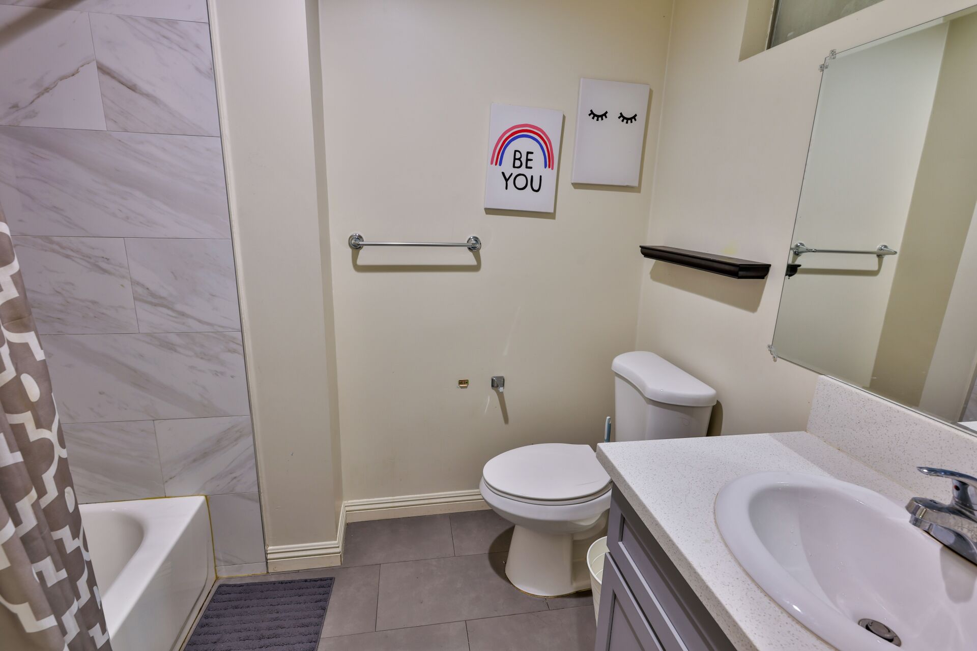 This image shows a bathroom with a sink and toilet.