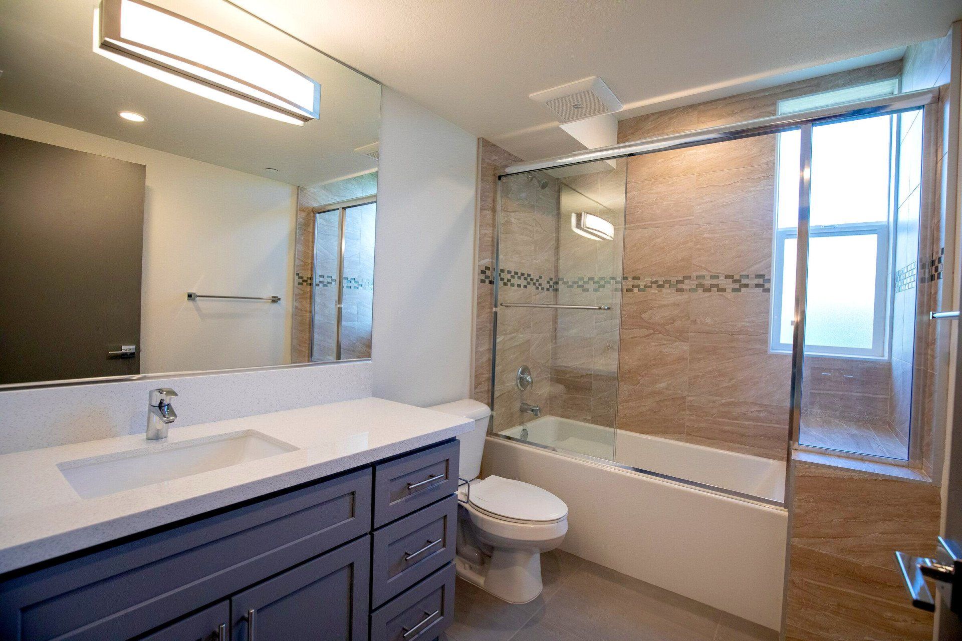 This image showing elegant bathroom with mirrors in it.