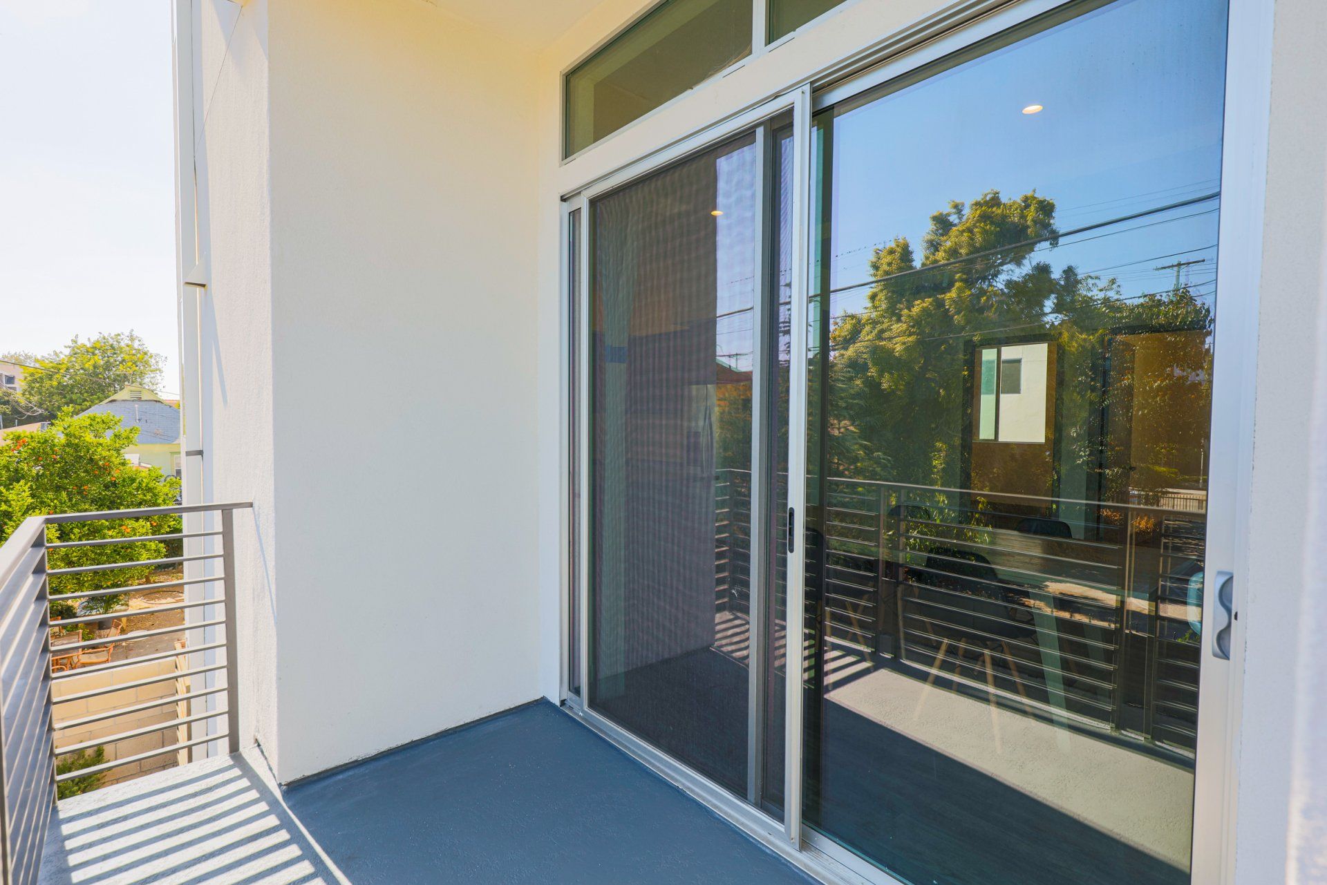 This image shows a sliding glass door on a tarrace.