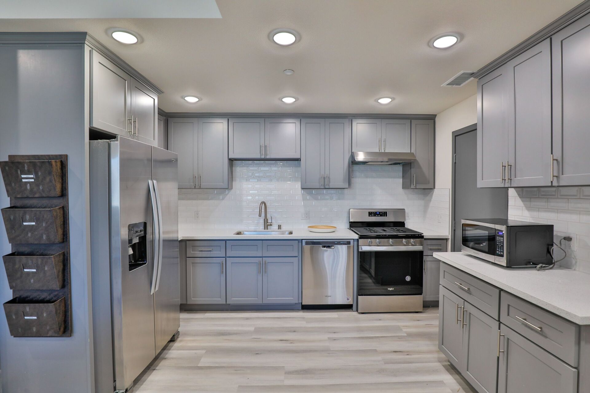 this image shows a kitchen of a house with grey background