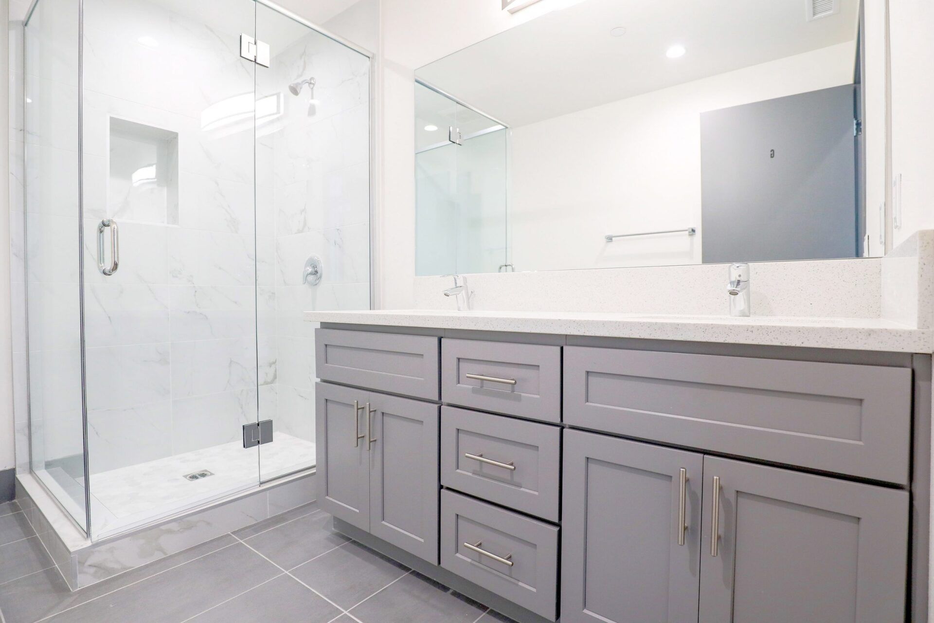 this image shows a small bathroom with grey background