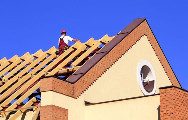 Man Working on New Roof Man Working on New Roof