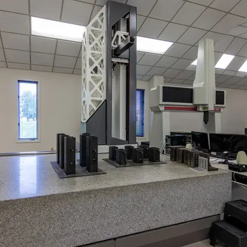 A large machine is sitting on top of a counter in a room.