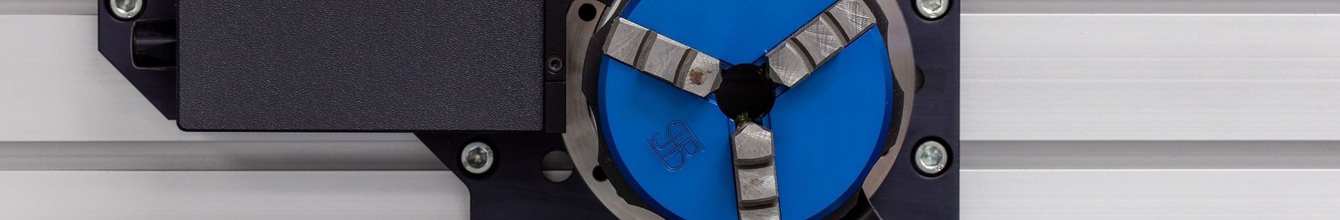 A close up of a blue and black clock on a wall.
