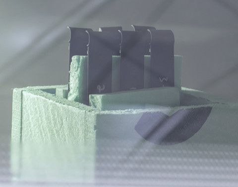 A close up of a 3d printed object on a table.