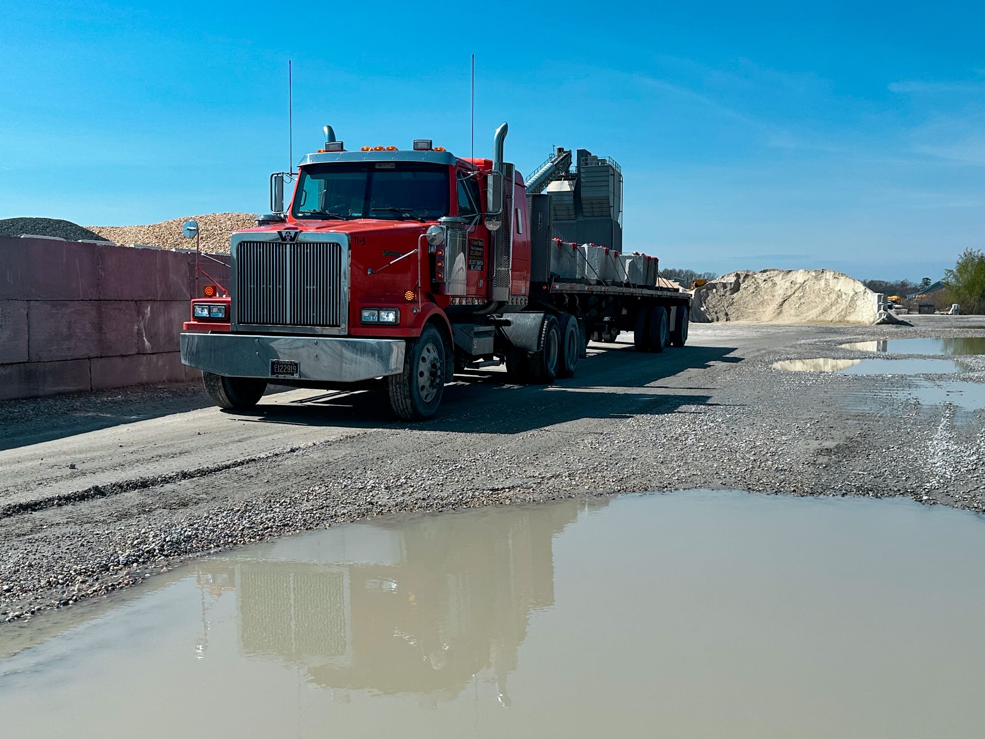 Heavy hauling safely transporting equipment to job site in Sussex County Delaware