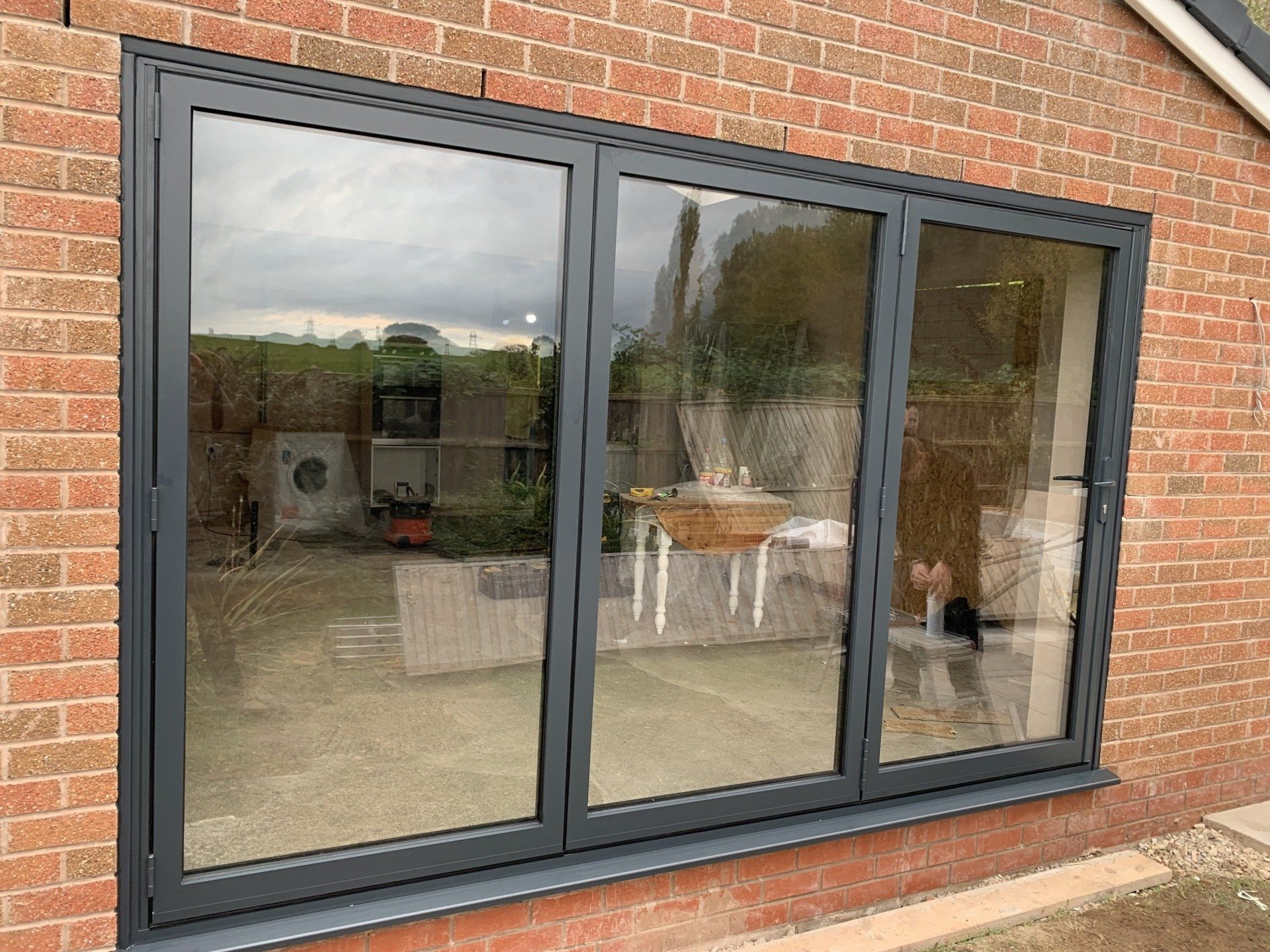 Anthracite grey aluminium bifold doors installed