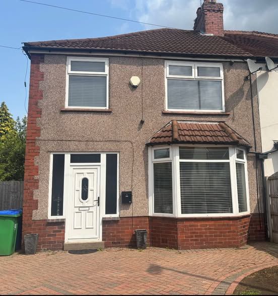 Modern property transformation in Middleton Manchester featuring a newly built porch, flush casement uPVC windows with mechanical joints, premium composite entrance door, reeded glass side panels, and specially sourced roof tiles installed by Peeco Ltd