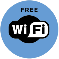 Free Wi-Fi sign in a blue circle with black and white WiFi logo.