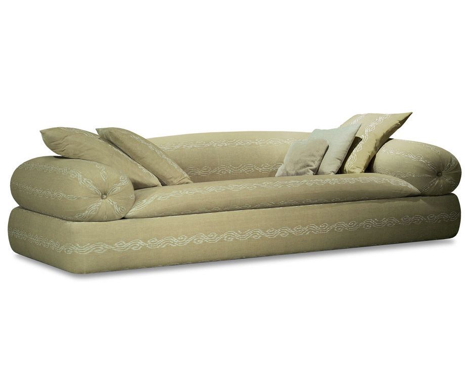 a beige couch with pillows on it on a white background