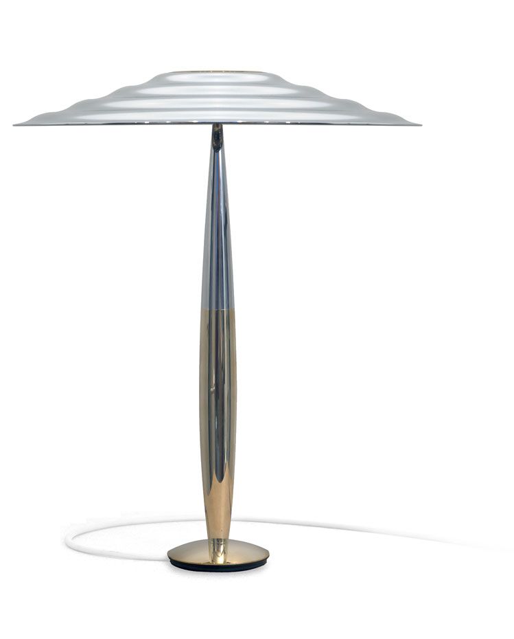 a silver table lamp with a striped shade on a white background .