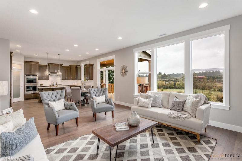 Living room filled with furniture and a large window
