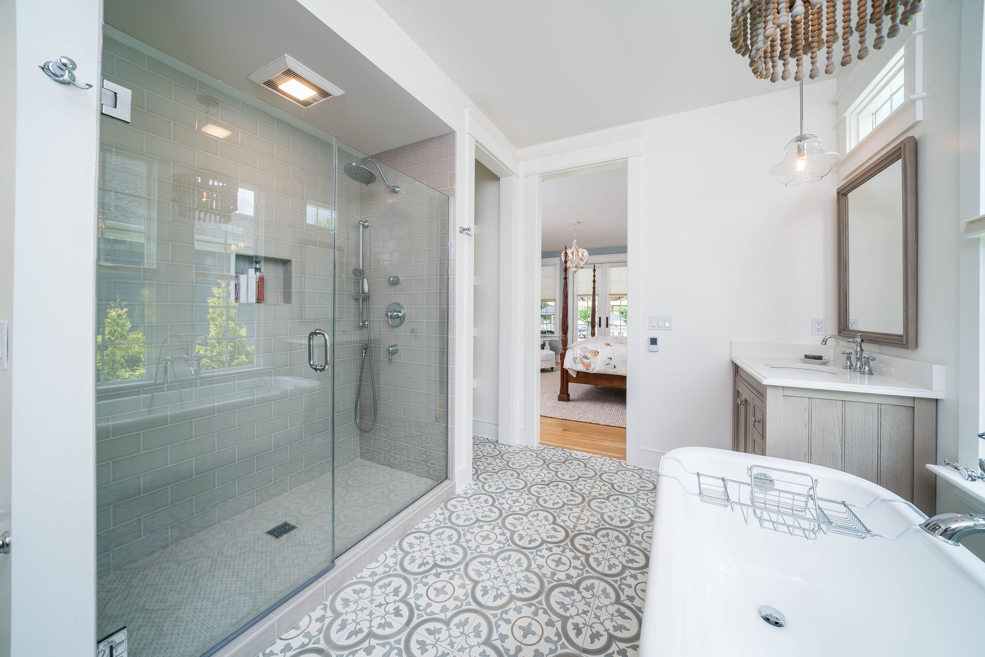 A bathroom with a walk in shower and a bathtub.