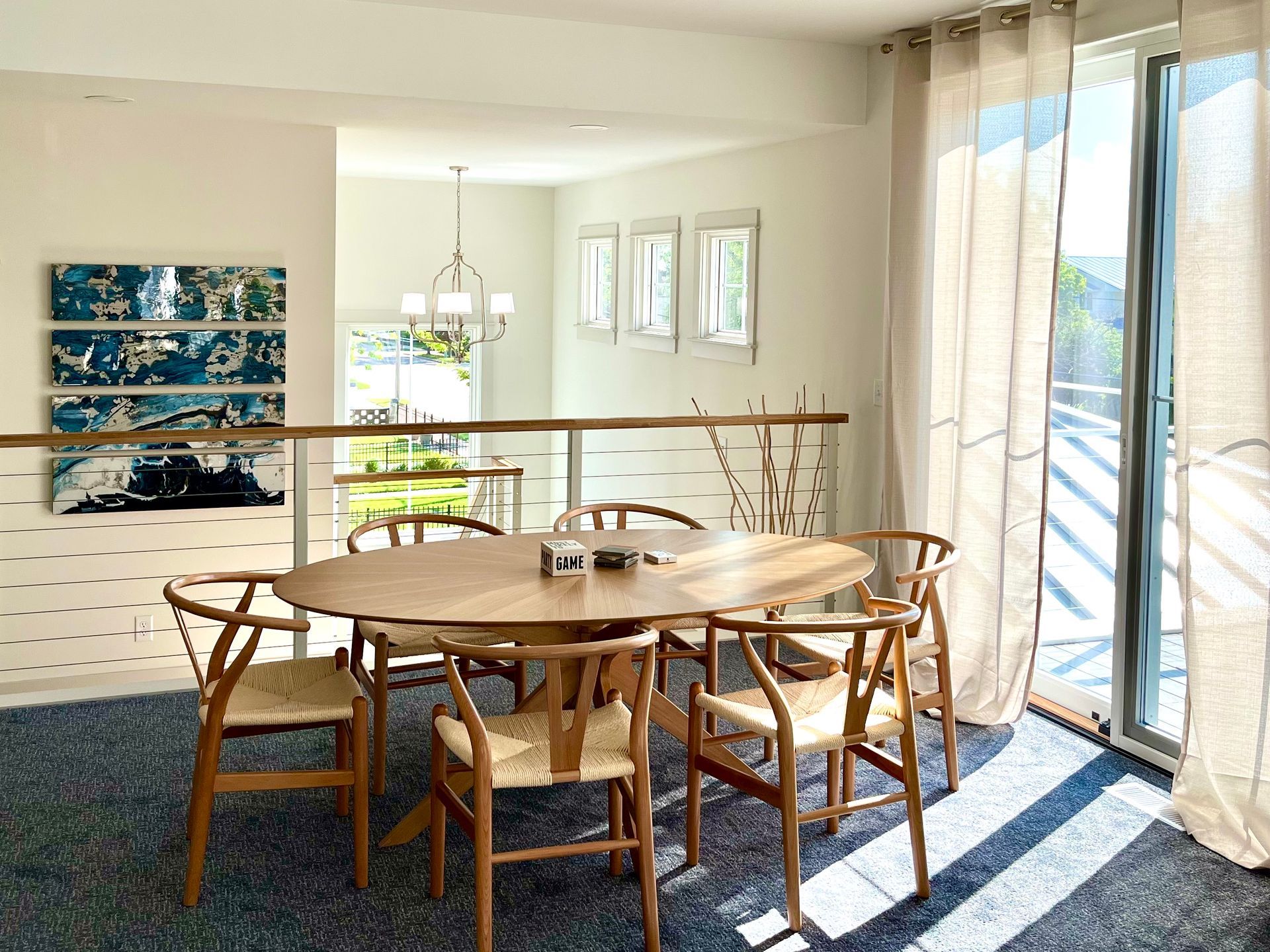 A dining room with a round table and chairs