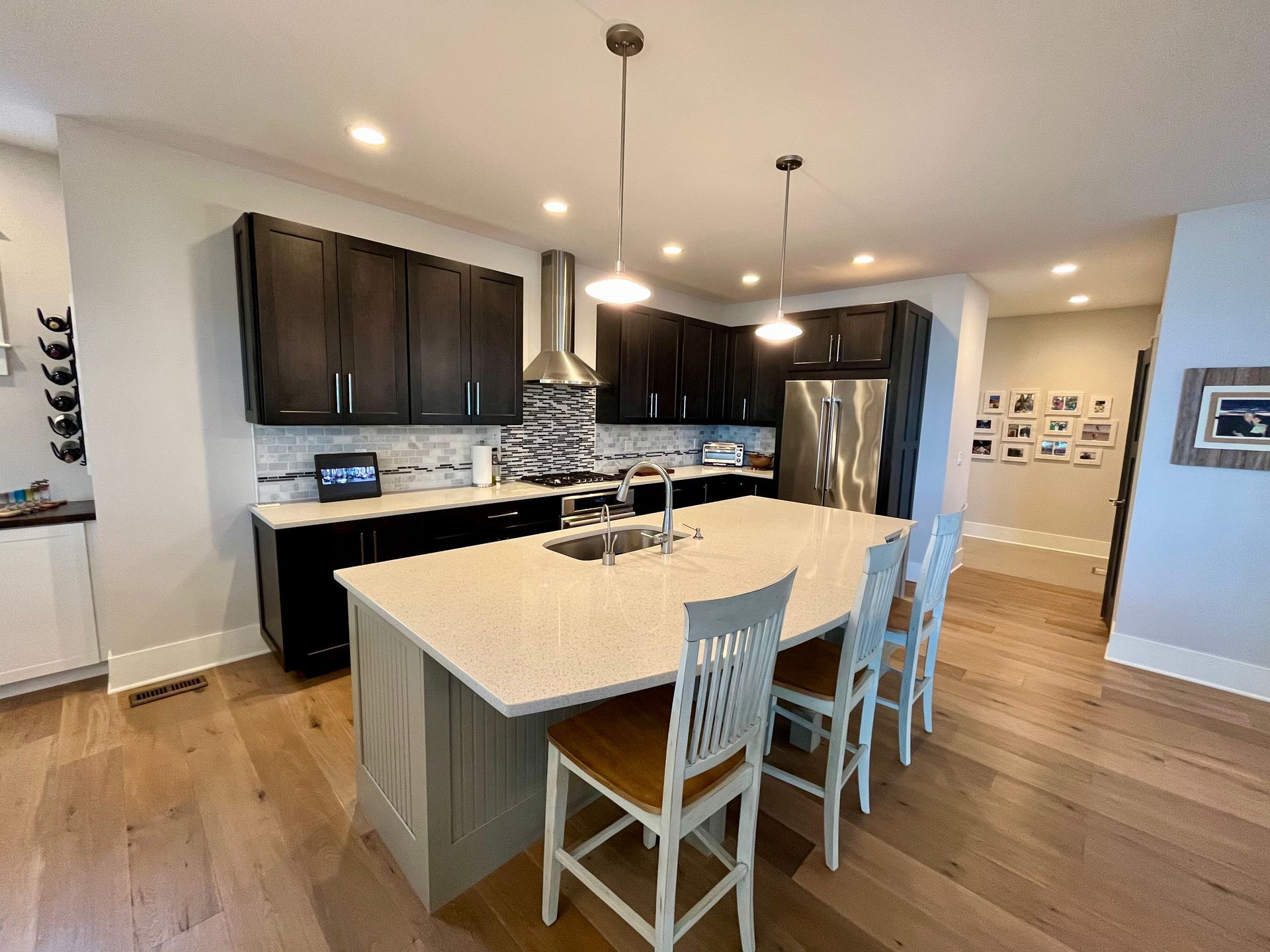 There is a large island in the middle of the kitchen.