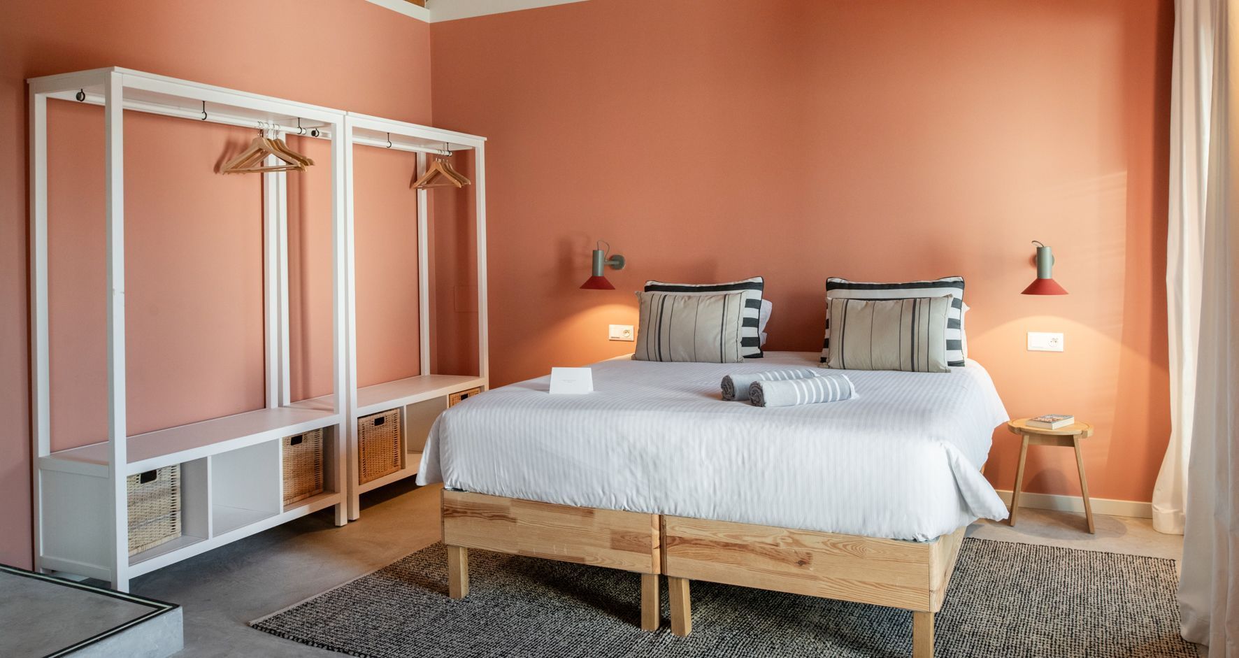 A bedroom with a bed , closet , and rug.